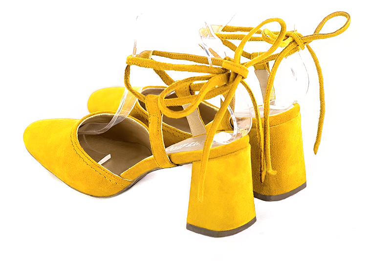 Yellow women's open back shoes, with crossed straps. Round toe. High flare heels. Rear view - Florence KOOIJMAN